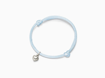 Heart pendant on silk bracelet